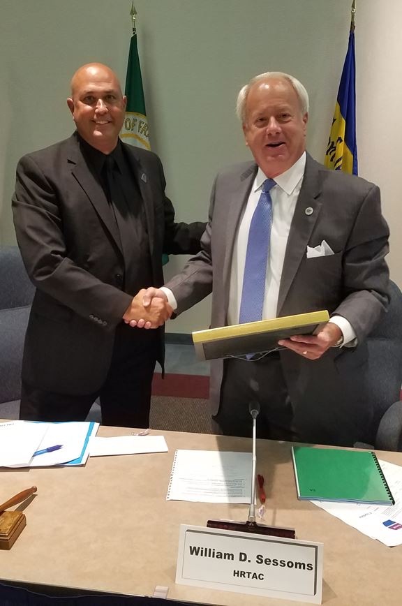 HRTAC Chair Michael J. Hipple Presenting a Resolution of Appreciation to Former Chair Mayor William 